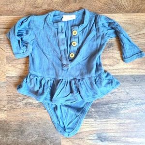 KATE QUINN BAMBOO RUFFLED LONGSLEEVED ONESIE